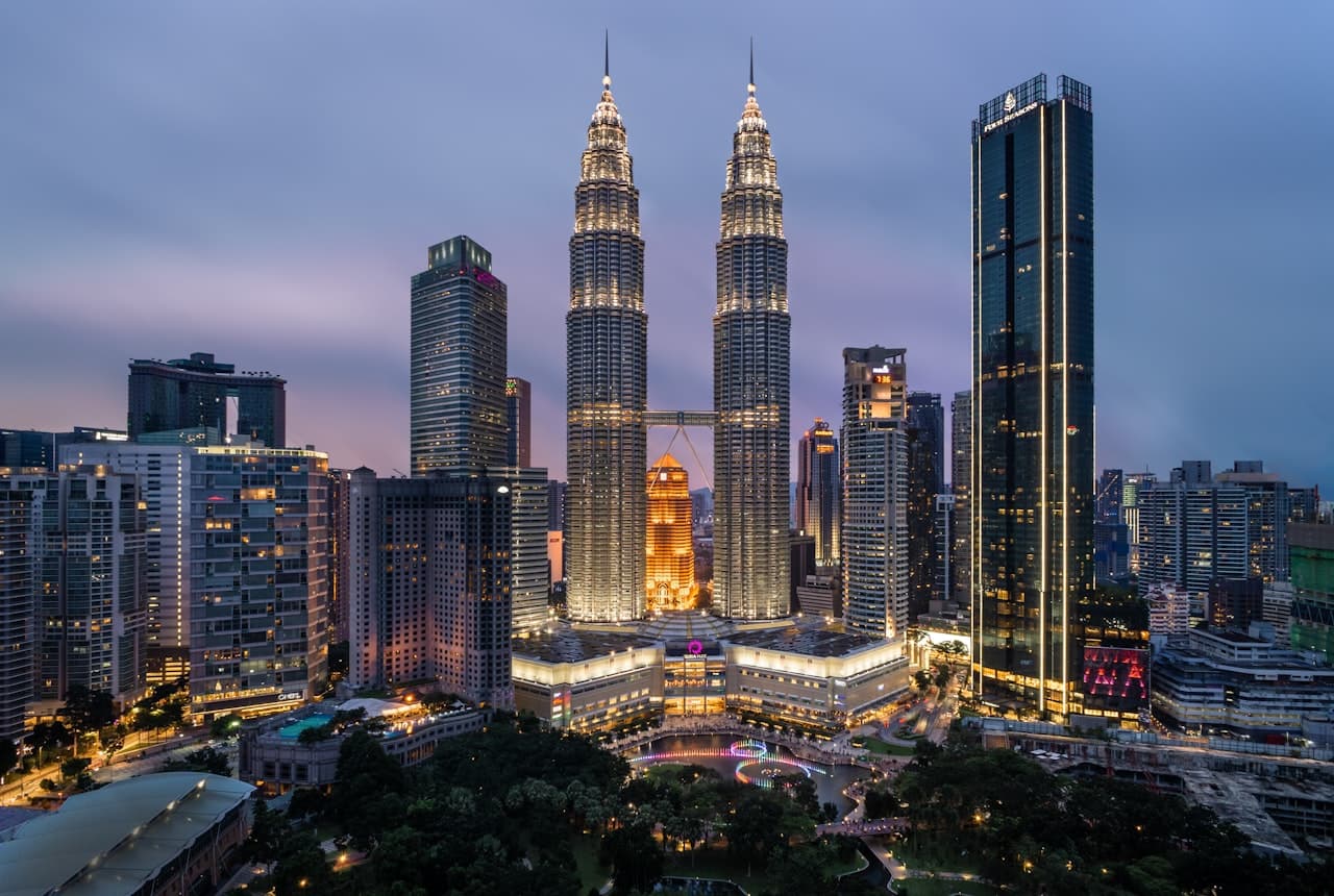 Petronas Towers and the Kuala Lumpur skyline at dusk, Malaysia
