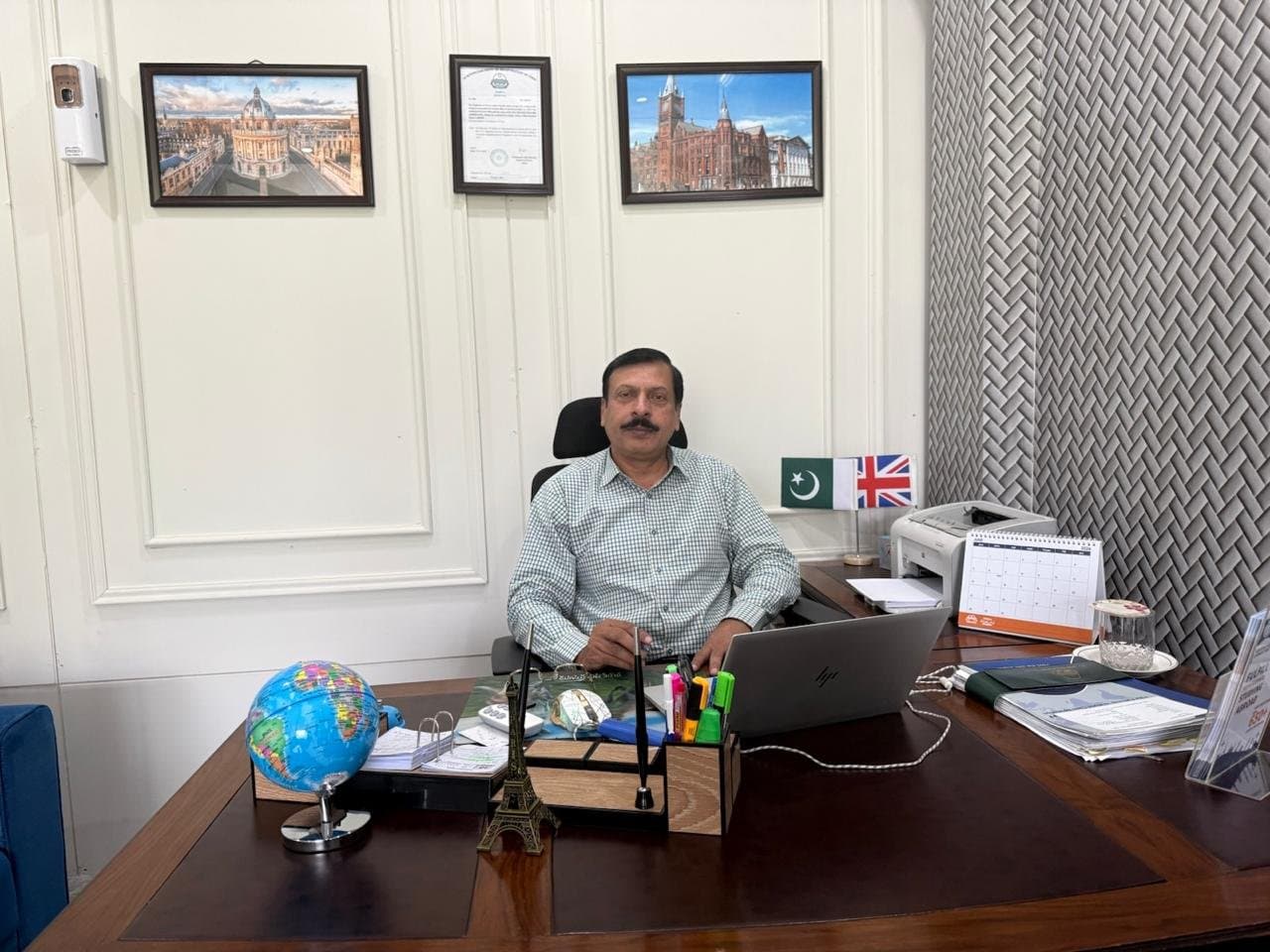 Dr. Muhammad Arif Raza, Founder & CEO of Eduventure Consultancy, at his desk in the Lahore office