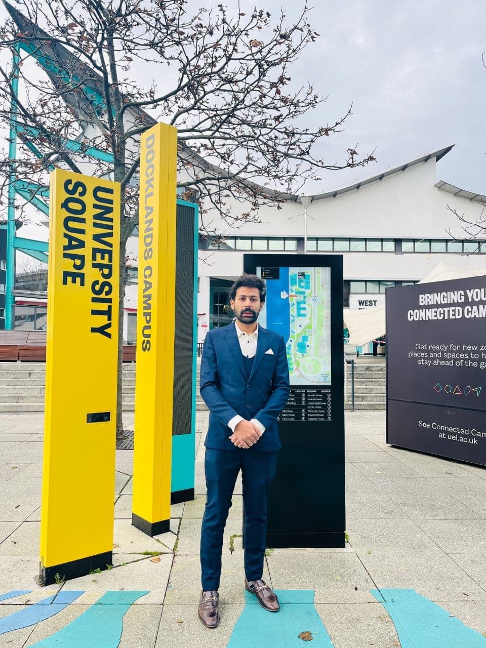 Our student standing at the University of East London Docklands Campus